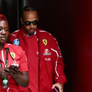 AUSTRALIAN GRAND PRIX, Lewis Hamilton of Ferrari (right) in the paddock at Albert Park Circuit in Melbourne, Victoria, Thursday, March 13, 2025