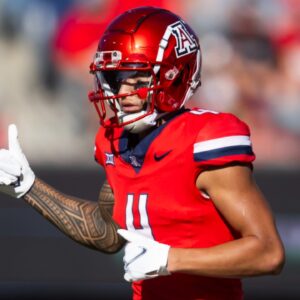 Nov 30, 2024; Tucson, Arizona, USA; Arizona Wildcats wide receiver Tetairoa McMillan (4) against the Arizona State Sun Devils during the Territorial Cup at Arizona Stadium.