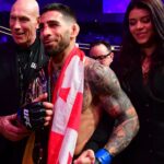Ilia Topuria celebrates his championship victory against Alexander Volkanovski during UFC 298 at Honda Center.