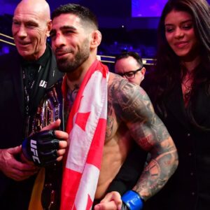 Ilia Topuria celebrates his championship victory against Alexander Volkanovski during UFC 298 at Honda Center.