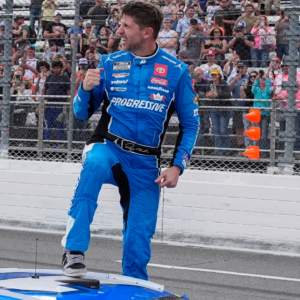 Mar 30, 2025; Martinsville, Virginia, USA; NASCAR Cup Series driver Denny Hamlin (11) reacts after his win at the Cook Out 400 at Martinsville Speedway. Mandatory Credit: Jim Dedmon-Imagn Images