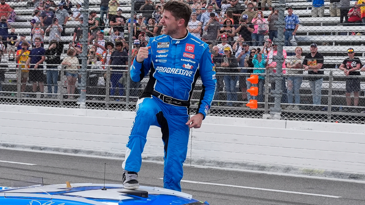 Mar 30, 2025; Martinsville, Virginia, USA; NASCAR Cup Series driver Denny Hamlin (11) reacts after his win at the Cook Out 400 at Martinsville Speedway. Mandatory Credit: Jim Dedmon-Imagn Images