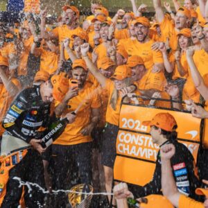 Lando Norris, Oscar Piastri and McLaren F1 team celebrate constructors championship title win during Formula One Abu Dhabi Grand Prix