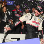 Nov 3, 2024; Martinsville, Virginia, USA; NASCAR Cup Series driver Ryan Blaney (12) celebrates his win in the Xfinity 500 at Martinsville Speedway. Mandatory Credit: Jim Dedmon-Imagn Images