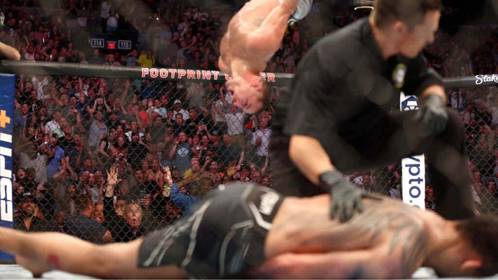 Spectators react as Michael Chandler does a backflip in celebration of his knockout victory against Tony Ferguson during UFC 274 at Footprint Center.