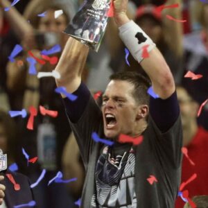 New England Patriots quarterback Tom Brady celebrates with the Vince Lombardi Trophy on the podium after defeating the Atlanta Falcons 34-28 in overtime in Super Bowl LI at NRG Stadium on Feb 5, 2017.