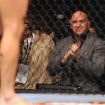 UFC President Dana White watches the match with a smile.