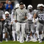 Oct 26, 2024; Boulder, Colorado, USA; Colorado Buffaloes head coach Deion Sanders leads out the team before the game against the Cincinnati Bearcats at Folsom Field.