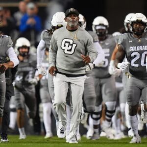 Oct 26, 2024; Boulder, Colorado, USA; Colorado Buffaloes head coach Deion Sanders leads out the team before the game against the Cincinnati Bearcats at Folsom Field.