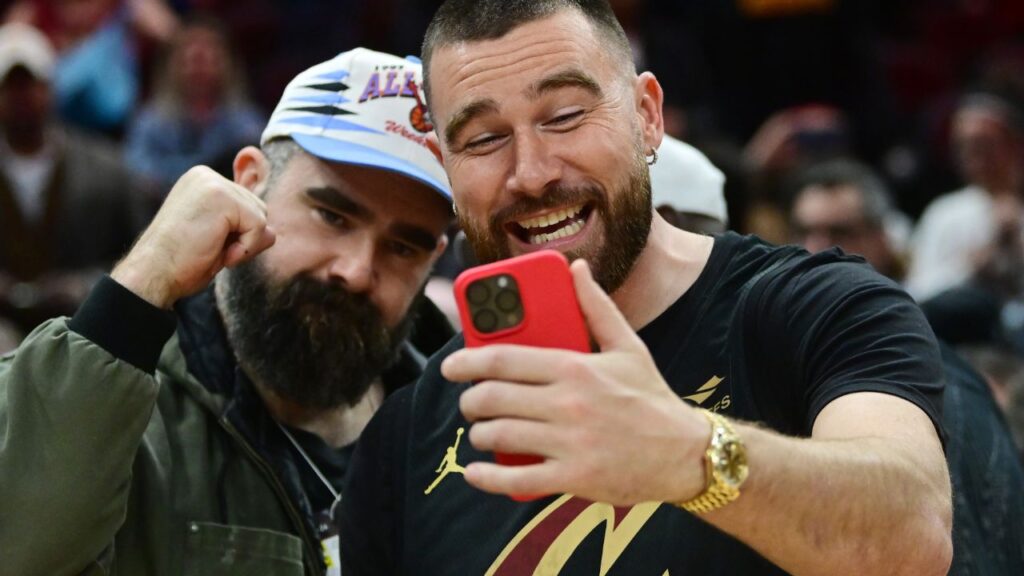 Cleveland natives and NFL players Travis, right, and Jason Kelce celebrate after the Cleveland Cavaliers beat the Boston Celtics during the second half at Rocket Mortgage FieldHouse.