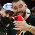 Cleveland natives and NFL players Travis, right, and Jason Kelce celebrate after the Cleveland Cavaliers beat the Boston Celtics during the second half at Rocket Mortgage FieldHouse.