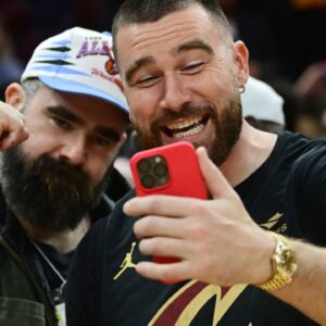 Cleveland natives and NFL players Travis, right, and Jason Kelce celebrate after the Cleveland Cavaliers beat the Boston Celtics during the second half at Rocket Mortgage FieldHouse.