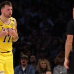 Los Angeles Lakers guard Luka Doncic (77) talks to NBA referee Brent Barnaky (36) during the second quarter against the Minnesota Timberwolves at Crypto.com Arena
