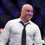 Joe Rogan after the fight between Amir Albazi (red gloves) and Francisco Figueiredo (blue gloves) during UFC 278 at Vivint Arena.