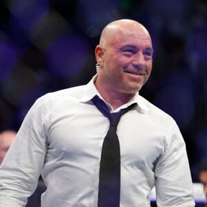 Joe Rogan after the fight between Amir Albazi (red gloves) and Francisco Figueiredo (blue gloves) during UFC 278 at Vivint Arena.