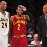 Cleveland Cavaliers head coach Byron Scott speaks with point guard Kyrie Irving (2) and Los Angeles Lakers shooting guard Kobe Bryant (24) during the first half at Staples Center.