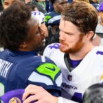 Dec 22, 2024; Seattle, Washington, USA; Seattle Seahawks quarterback Geno Smith (7) and Minnesota Vikings quarterback Sam Darnold (14) hug after the game at Lumen Field.
