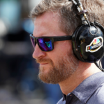 Former NASCAR driver and TV analyst Dale Earnhardt Jr. reporting in the garage area for NBCsn during practice for the 1000Bulbs.com 500 at Talladega Superspeedway.