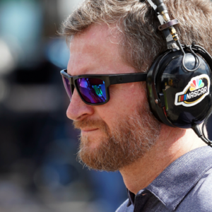 Former NASCAR driver and TV analyst Dale Earnhardt Jr. reporting in the garage area for NBCsn during practice for the 1000Bulbs.com 500 at Talladega Superspeedway.