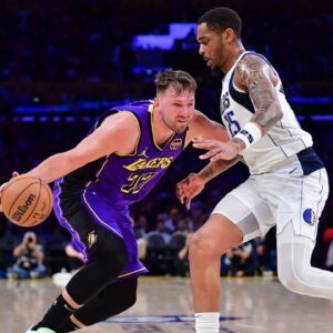 Los Angeles Lakers guard Luka Doncic (77) dribbles the ball against Dallas Mavericks forward P.J. Washington (25) during the second half at Crypto.com Arena.