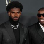 Deion Sanders (right) with his son Shedeur Sanders on the red carpet before Super Bowl LIX NFL Honors at Saenger Theatre.