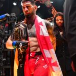 Ilia Topuria celebrates his championship victory against Alexander Volkanovski during UFC 298 at Honda Center.