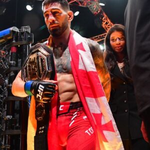 Ilia Topuria celebrates his championship victory against Alexander Volkanovski during UFC 298 at Honda Center.
