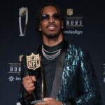 Washington Commanders quarterback Jayden Daniels poses with the Offensive Rookie of the Year award during Super Bowl LIX NFL Honors at Saenger Theatre. Mandatory