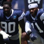 Jul 30, 2024; Oxnard, CA, USA; Dallas Cowboys defensive end DeMarcus Lawrence (90) and linebacker Micah Parsons (11) during training camp at the River Ridge Playing Fields in Oxnard, California.