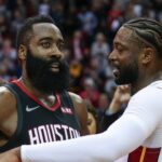 Houston Rockets guard James Harden (13) and Miami Heat guard Dwyane Wade (3) talk on the court after the game at Toyota Center.