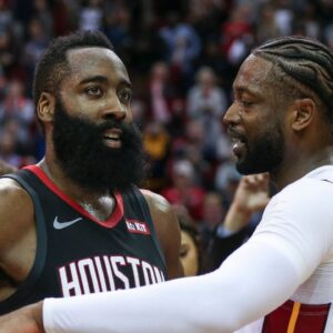 Houston Rockets guard James Harden (13) and Miami Heat guard Dwyane Wade (3) talk on the court after the game at Toyota Center.