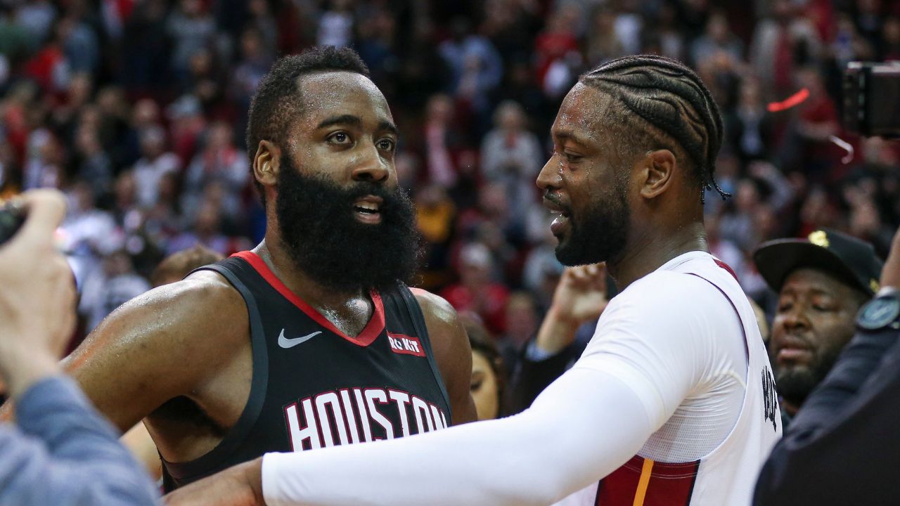 Houston Rockets guard James Harden (13) and Miami Heat guard Dwyane Wade (3) talk on the court after the game at Toyota Center.