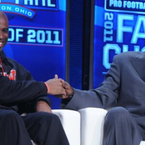 Deion Sanders (left) and Dallas Cowboys legend Michael Irvin at the 2011 Pro Football Hall of Fame announcement show at the Super Bowl XLV media center at the International Conference and Exposition Center.