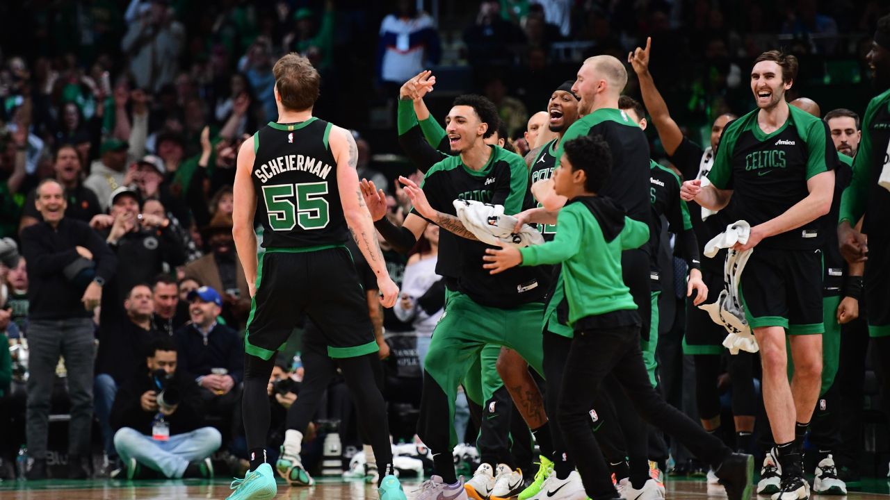Boston Celtics forward Baylor Scheierman (55) reacts with the bench after hitting a three point shot during the second half at TD Garden.
