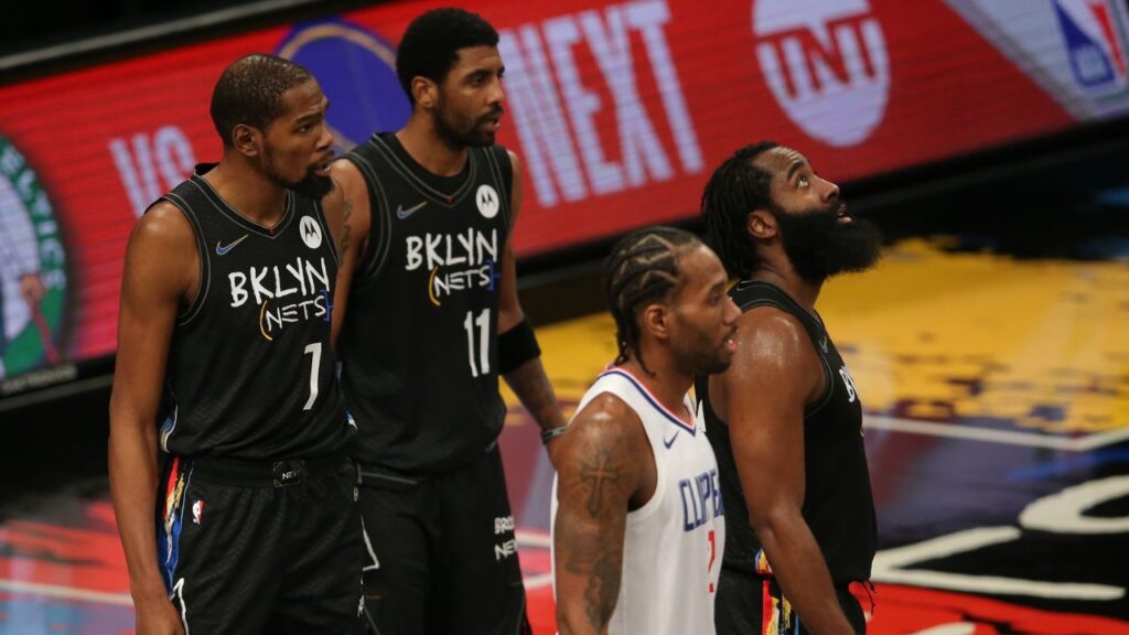 Brooklyn Nets power forward Kevin Durant (7) and point guard Kyrie Irving (11) and shooting guard James Harden (13) and Los Angeles Clippers small forward Kawhi Leonard (2) await a replay review during the fourth quarter at Barclays Center.