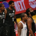Brooklyn Nets power forward Kevin Durant (7) and point guard Kyrie Irving (11) and shooting guard James Harden (13) and Los Angeles Clippers small forward Kawhi Leonard (2) await a replay review during the fourth quarter at Barclays Center.