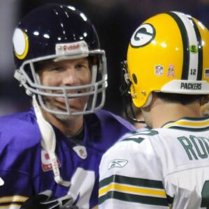 Green Bay Packers quarterback Aaron Rodgers (12) meets with Minnesota Vikings quarterback Brett Favre at midfield on Oct. 5, 2009, at the Metrodome in Minneapolis.