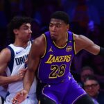 Los Angeles Lakers forward Rui Hachimura (28) dribbles the ball on Dallas Mavericks guard Max Christie (00) during the first quarter at Crypto.com Arena