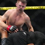 ; Bryce Mitchell (red gloves) reacts to defeating Kron Gracie (blues gloves) at T-Mobile Arena.