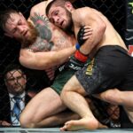 Khabib Nurmagomedov (red gloves) fights Conor McGregor (blue gloves) during UFC 229 at T-Mobile Arena.