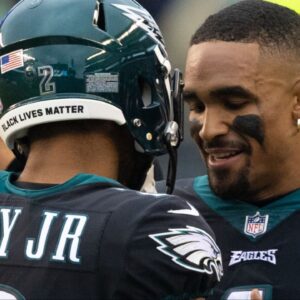 Philadelphia Eagles quarterback Jalen Hurts (1) talks with cornerback Darius Slay (2) after his interception return for a touchdown against the New Orleans Saints during the second quarter at Lincoln Financial Field.