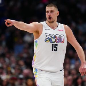 Denver Nuggets center Nikola Jokic (15) points in the second half against the Phoenix Suns at Ball Arena.