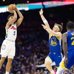 Philadelphia 76ers guard Quentin Grimes (5) scores past Golden State Warriors guard Brandin Podziemski (2) during the second quarter at Wells Fargo Center