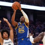 Golden State Warriors forward Jonathan Kuminga (00) shoots a jumpshot against Memphis Grizzlies forward Jaylen Wells (0) and forward/center Jaren Jackson Jr. (13) in the second quarter at Chase Center.