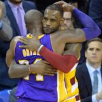 Cleveland Cavaliers forward LeBron James (23) hugs Los Angeles Lakers forward Kobe Bryant (24) near the end of the Cavaliers' 120-111 win at Quicken Loans Arena