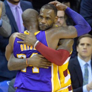 Cleveland Cavaliers forward LeBron James (23) hugs Los Angeles Lakers forward Kobe Bryant (24) near the end of the Cavaliers' 120-111 win at Quicken Loans Arena