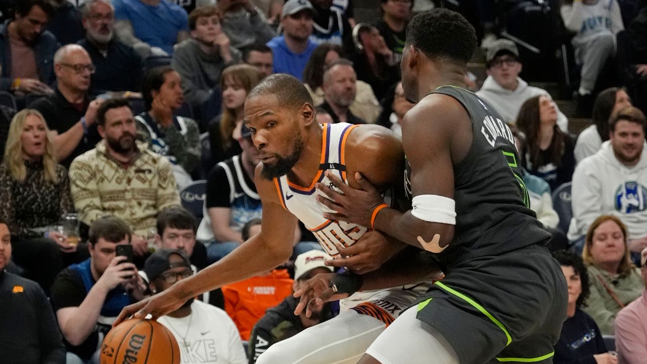 Phoenix Suns forward Kevin Durant (35) works around Minnesota Timberwolves guard Anthony Edwards (5) in the fourth quarter at Target Center.