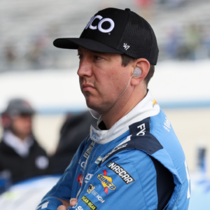 NASCAR Cup Series driver Kyle Busch looks at a computer on pit road during practice and qualifying for the Wurth 400 at Dover Motor Speedway.