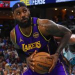 Los Angeles Lakers forward LeBron James (23) spins toward the basket as Memphis Grizzlies guard Scotty Pippen Jr. (1) and Memphis Grizzlies guard Desmond Bane (22) defend during the second quarter at FedExForum