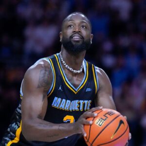 Former Marquette Golden Eagles player Dwyane Wade shoots during a timeout during the first half of the game against the Providence Friars at Fiserv Forum.